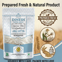 Dinesh Flour Mills Jau Atta packaging with branding and product information on a beige background.