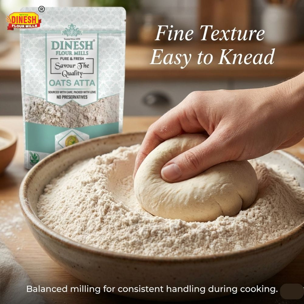 Person kneading dough in a bowl with Dinesh Atta packaging in the background