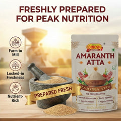 Dinesh Amaranth Atta packaging with mortar and pestle on a wooden surface, featuring text about freshness and nutrition.