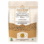 A stand-up pouch of Dinesh Flour Mills Basmati Rice on a plain white background. The packaging is cream and gold with a damask pattern, featuring a clear window showing the brown rice grains inside.