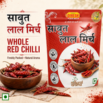 A stand-up pouch of Dinesh Flour Mills Whole Red Chilli spice mix shown on a beige background with Hindi text, a bowl of dried red chilies, and scattered red chili powder.