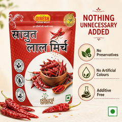 A package of Dinesh Flour Mills Sabut Lal Mirch (red chili powder) shown on a light beige background with decorative red chili peppers and text highlighting its natural, additive-free qualities.