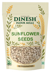 Packaging of Dinesh Flour Mills sunflower seeds with decorative elements on a beige background.