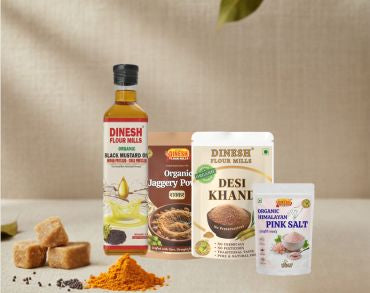 Collection of Dinesh Flour Mills products including a bottle, jar, and packets on a neutral background.